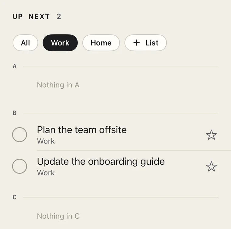 Up Next with the Work list chosen: 2 tasks. A shows Nothing in A, B holds Plan the team offsite and Update the onboarding guide, and C shows Nothing in C.